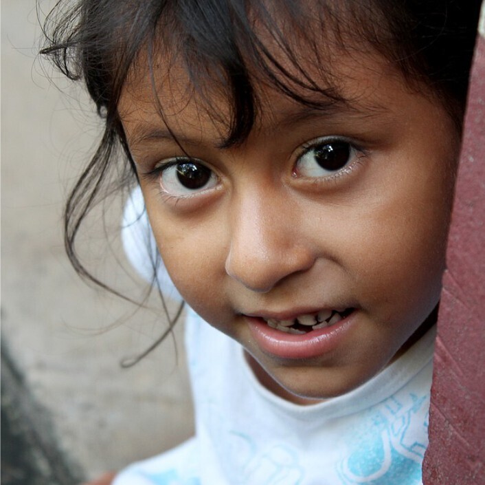 close up of child looking into camera
