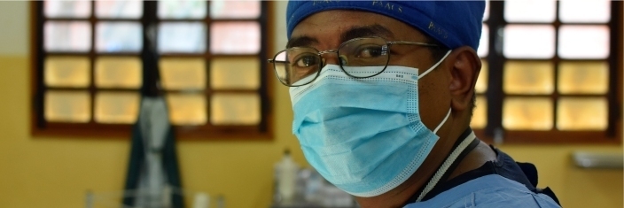 The masked face of a surgeon