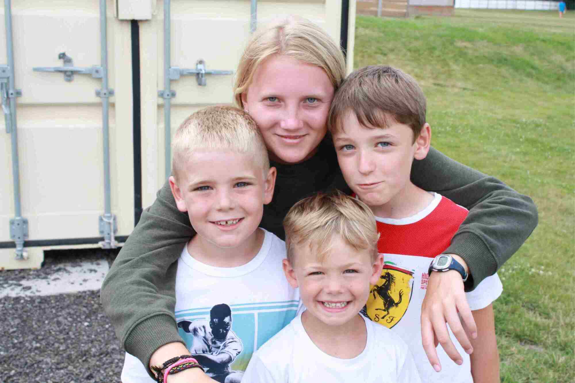 Four kids smiling for a picture